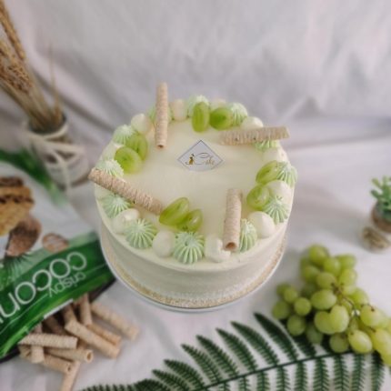 Tropical Harmony Unleashed: Delight in Our Coconut Pandan and Grapes Chiffon Cake - A Culinary Oasis of Flavors!
