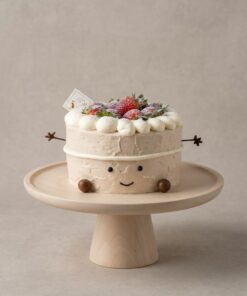 Milk tea Jellycat-inspired chiffon cake with a smiling face, chocolate arms, cream crown and strawberries by iCake Melbourne