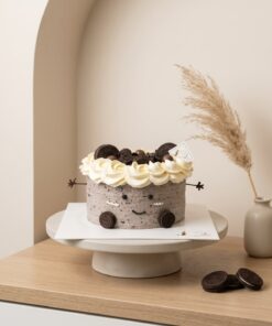 Oreo Jellycat-inspired cake with speckled grey cream, a white cream crown, cookie ears and mini Oreo feet by iCake Melbourne