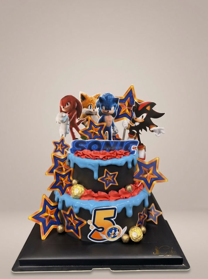 Two-tier Sonic the Hedgehog birthday cake with black icing, blue drip, character toppers and stars by iCake Melbourne